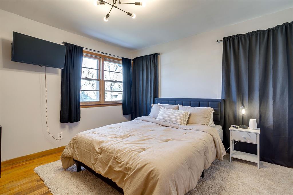 809 Euclid Street Cleburne, TX 76033 - Photo 16 of 26 a bedroom with a bed and a window