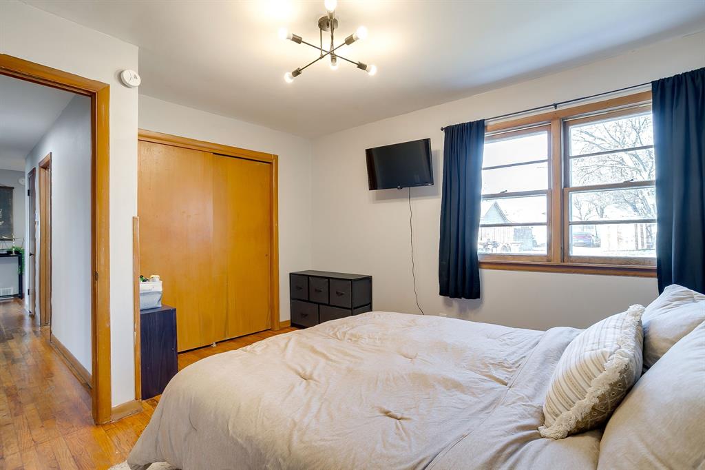 809 Euclid Street Cleburne, TX 76033 - Photo 17 of 26 a bedroom with a bed and a window