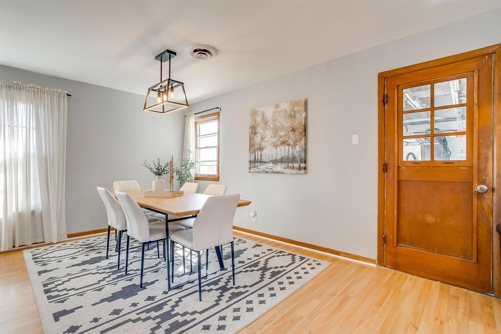 809 Euclid Street Cleburne, TX 76033 - Photo 8 of 26 a view of a dining room with furniture window and wooden floor