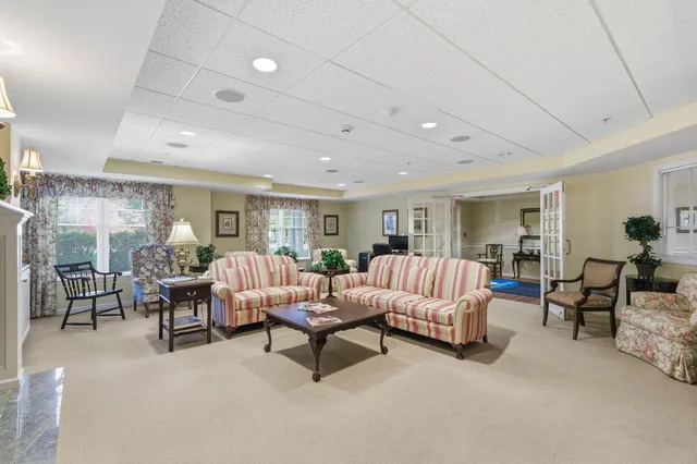 a living room with furniture and a table