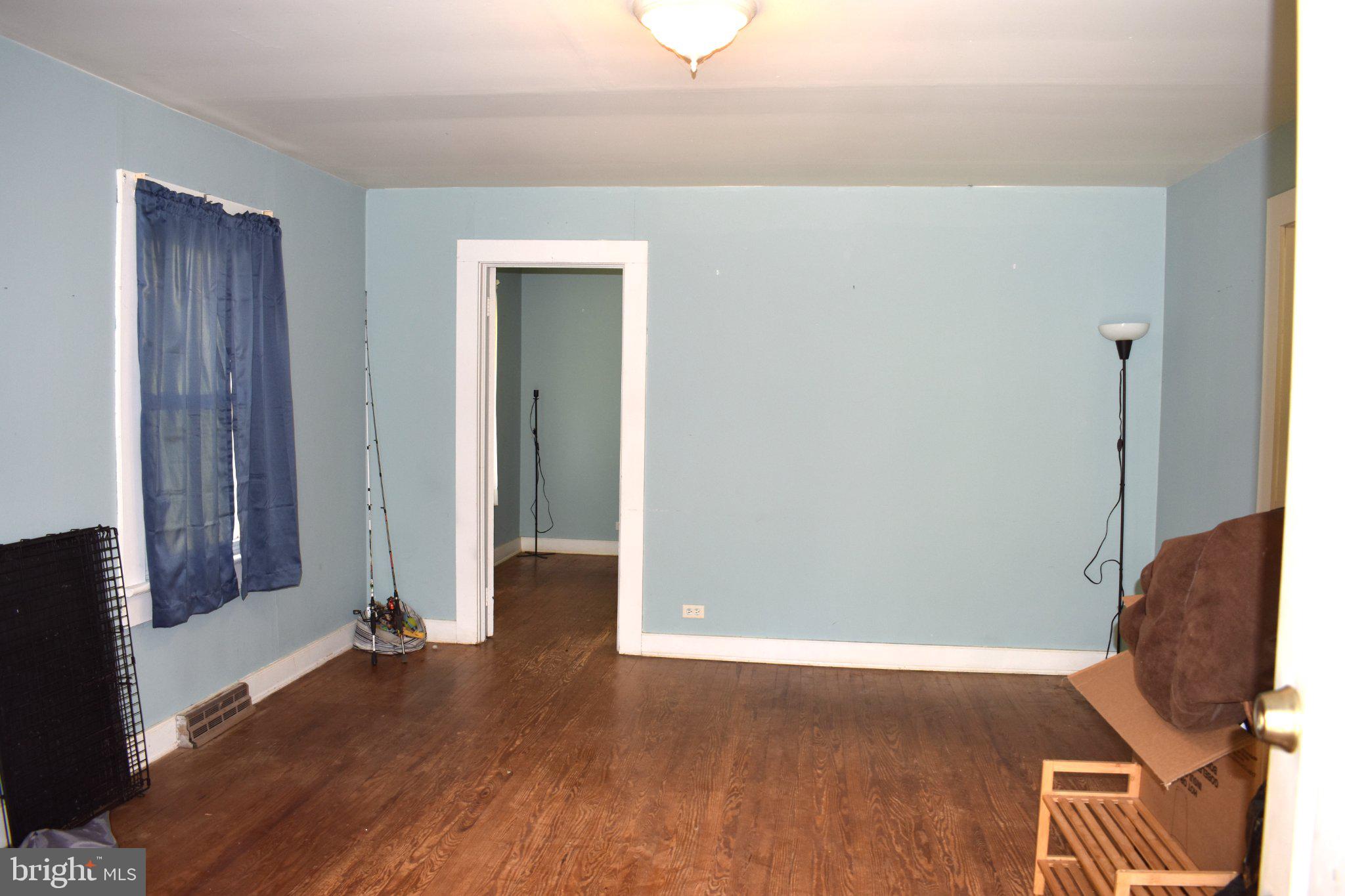 7191 Porters Road Esmont, VA 22937 - Photo 4 of 14 Spacious room with calming blue walls.