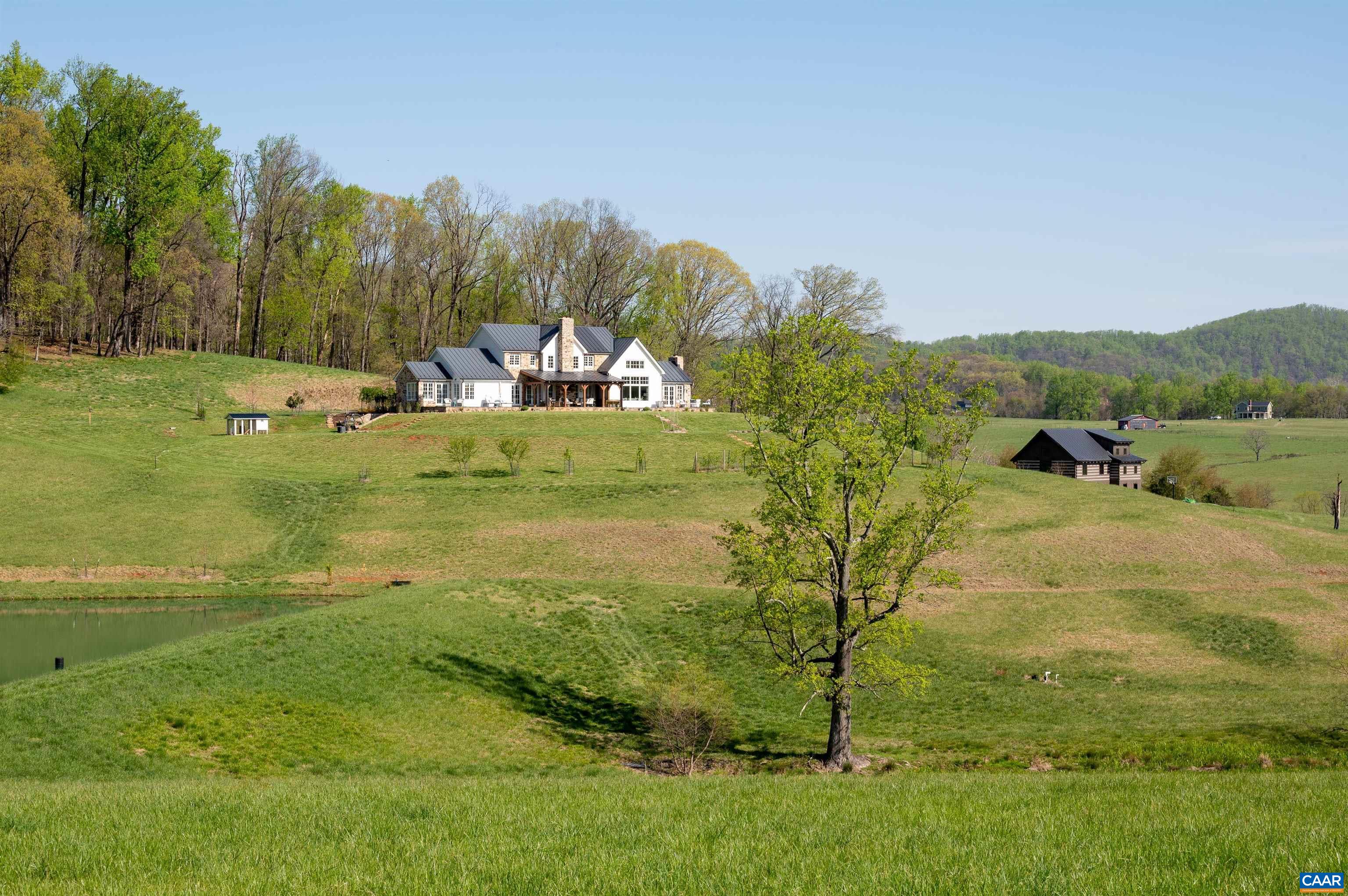 3140 Sutherland Road North Garden, VA 22959 - Photo 1 of 37 a view of a town with mountains in the background