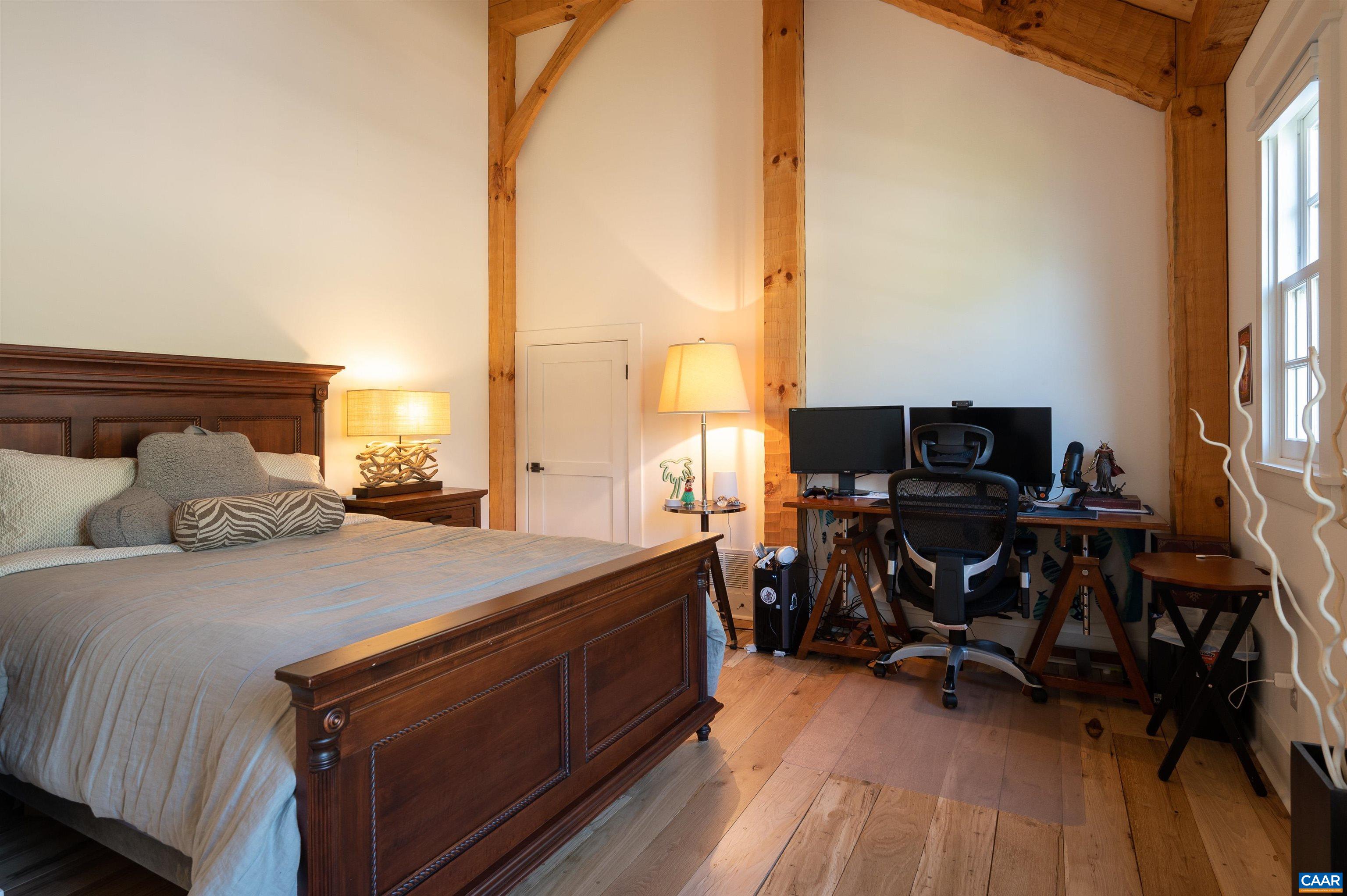 3140 Sutherland Road North Garden, VA 22959 - Photo 15 of 37 a bed room with a bed and a chair