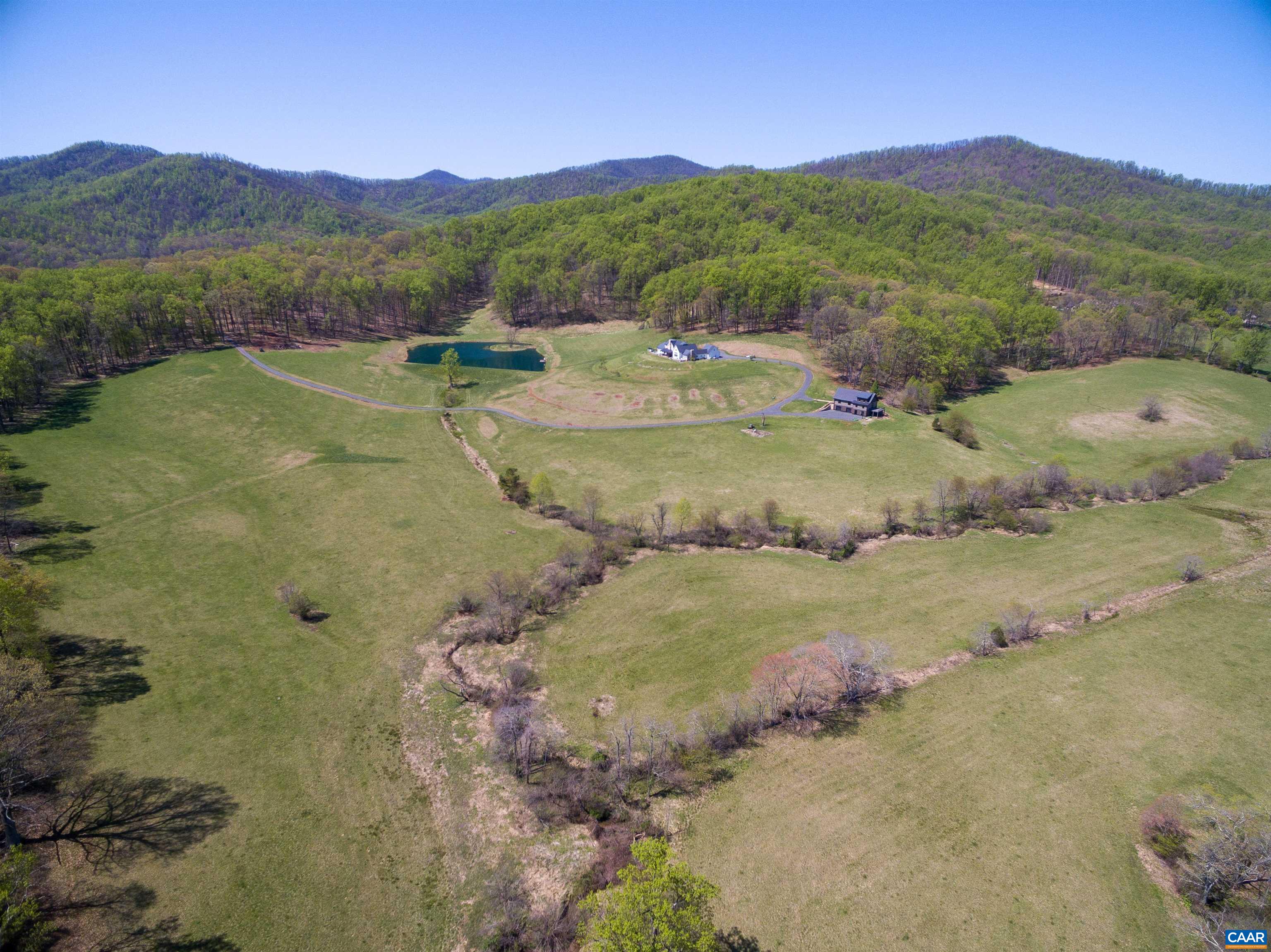 3140 Sutherland Road North Garden, VA 22959 - Photo 35 of 37 a view of a lush green hillside and houses