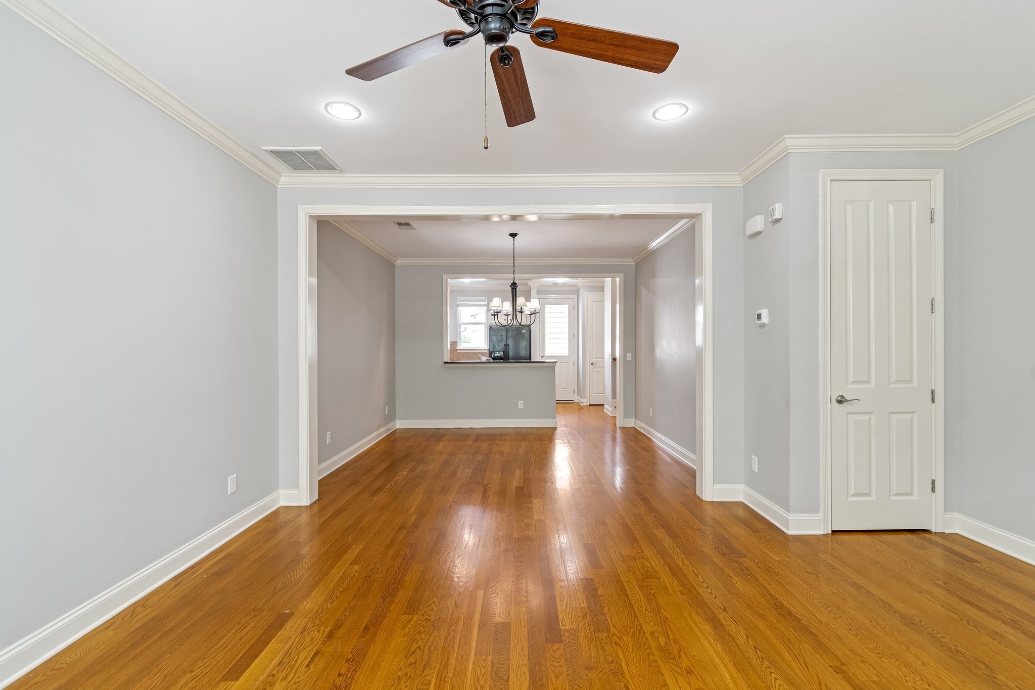 318 Byron Way Franklin, TN 37064 - Photo 9 of 53 a view of an empty room and window with wooden floor