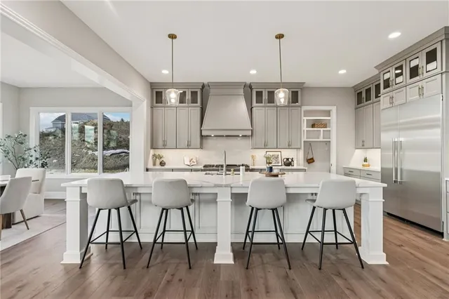 a dining room with furniture a chandelier and fireplace