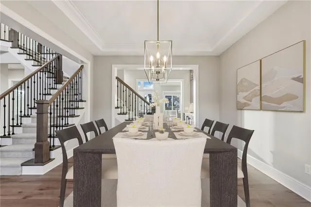 a view of a hallway with wooden floor and entryway