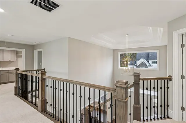 a view of living room and wooden floor