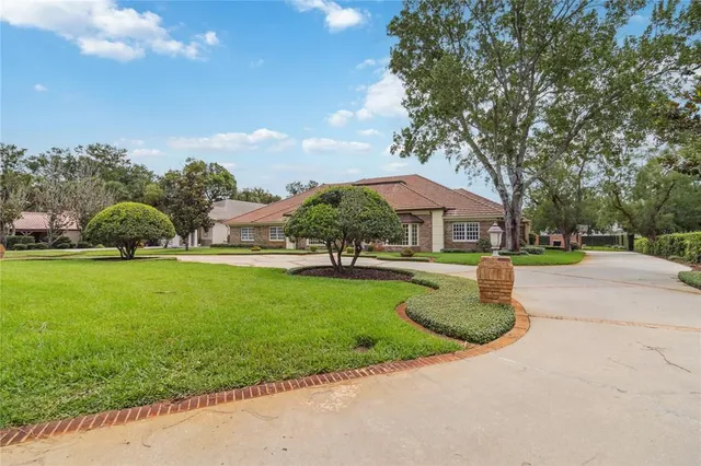 a front view of a house with a yard and a garage