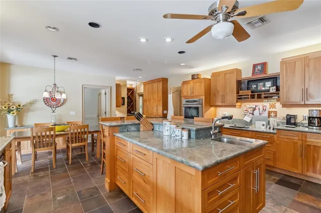 a bed room with a bed a window and a potted plant