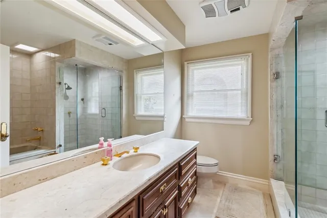 a bedroom with a bed and cabinets