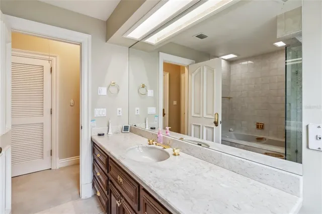 a bathroom with a tub and a shower