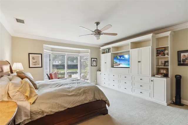 a view of a patio with a dining table and chairs under an umbrella