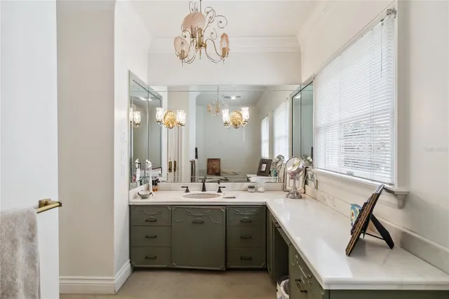 a view of a patio with a table and chairs and potted plants
