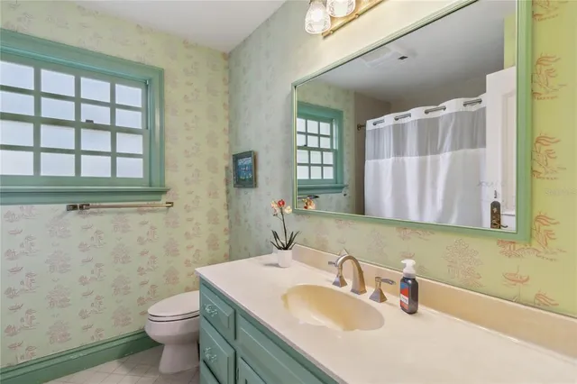 a aerial view of a house with a yard