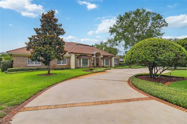 a living room with furniture and a dining table with wooden floor