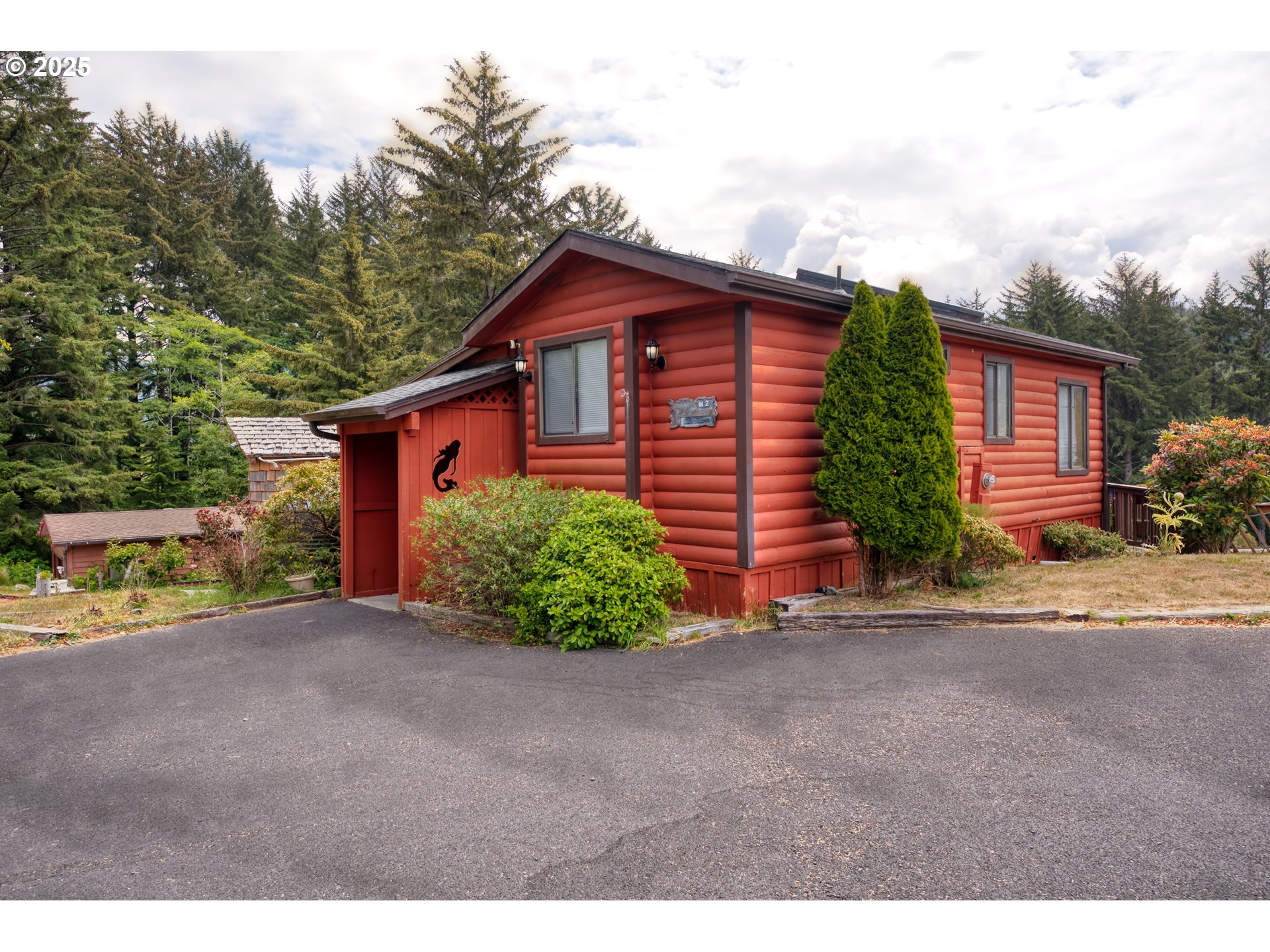 a view of a house with a yard and garage