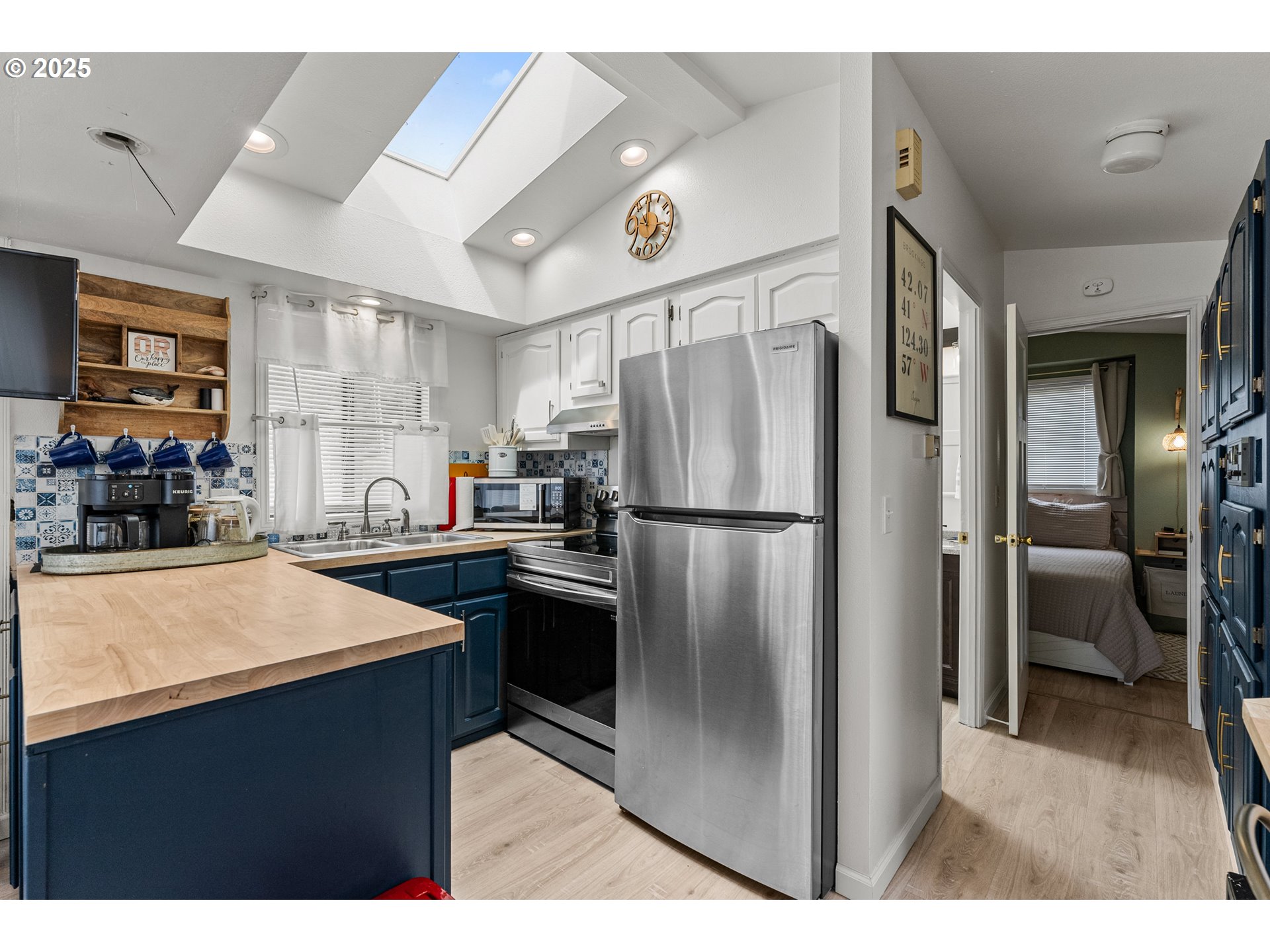 19921 Whaleshead Road, Unit M2 Brookings, OR 97415 - Photo 18 of 29 a kitchen with stainless steel appliances a refrigerator and a stove top oven