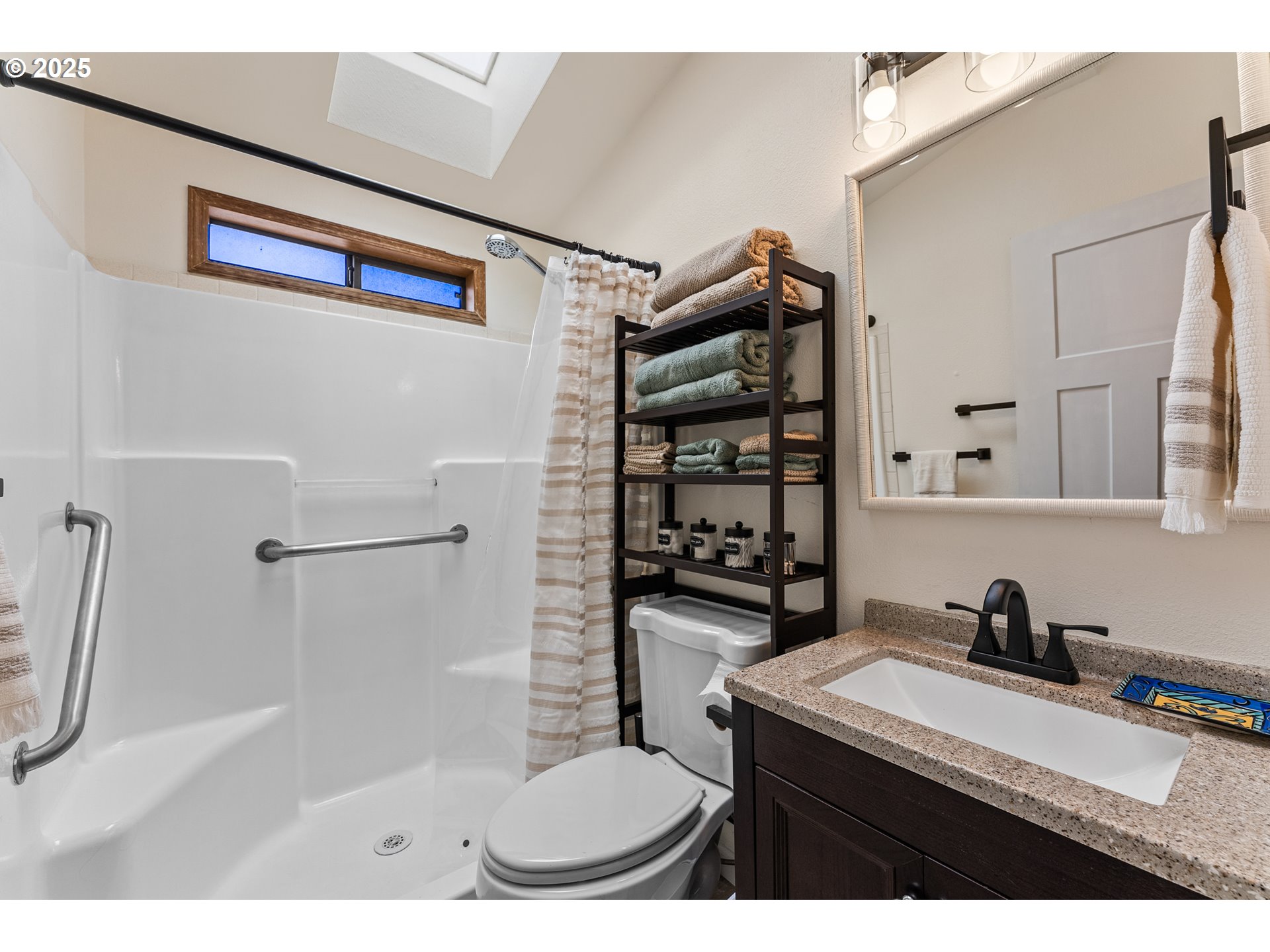 19921 Whaleshead Road, Unit M2 Brookings, OR 97415 - Photo 19 of 29 a bathroom with a sink toilet and shower