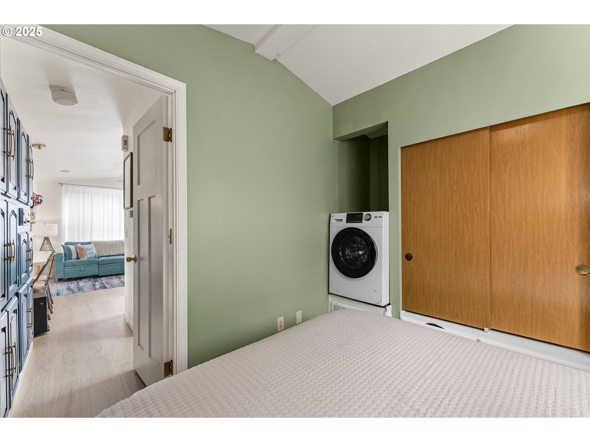 19921 Whaleshead Road, Unit M2 Brookings, OR 97415 - Photo 21 of 29 a bedroom with a bed and a view of bathroom