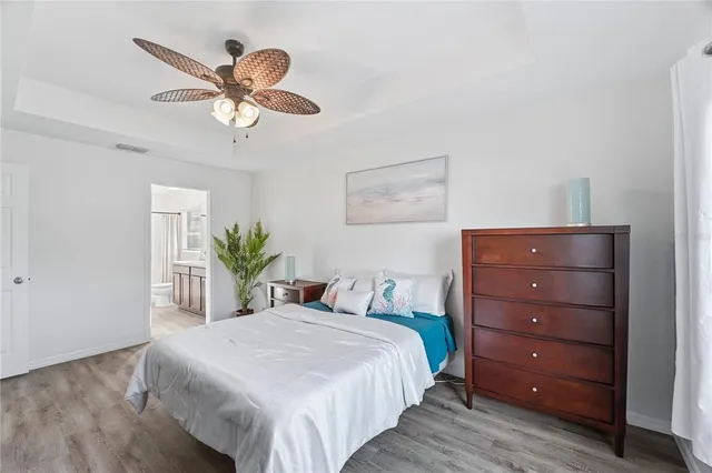 a bedroom with a bed and a dresser