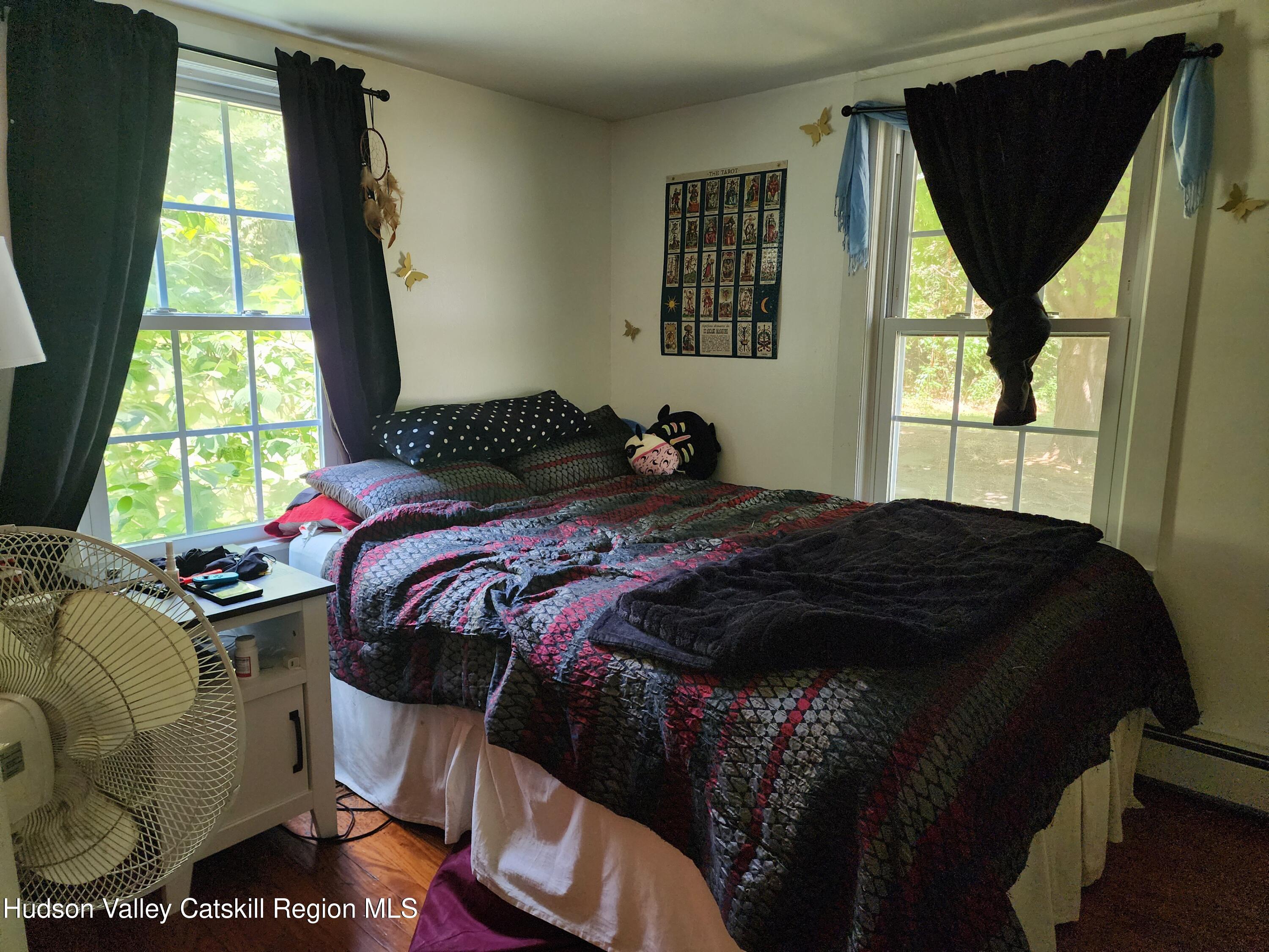 9 Hamm Road Durham, NY 12422 - Photo 11 of 21 a bedroom with a bed and windows
