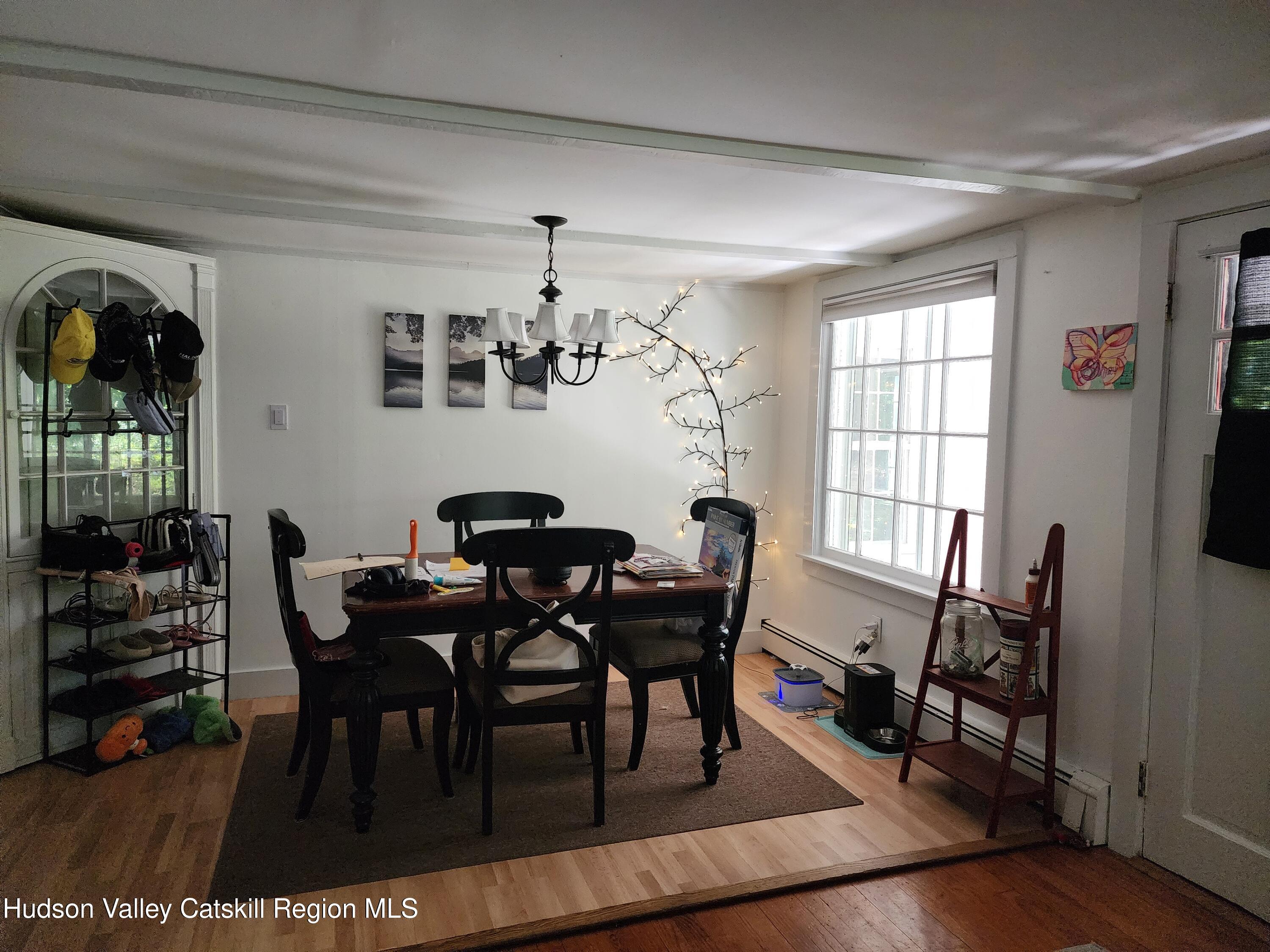 9 Hamm Road Durham, NY 12422 - Photo 15 of 21 a view of a dining room with furniture and wooden floor