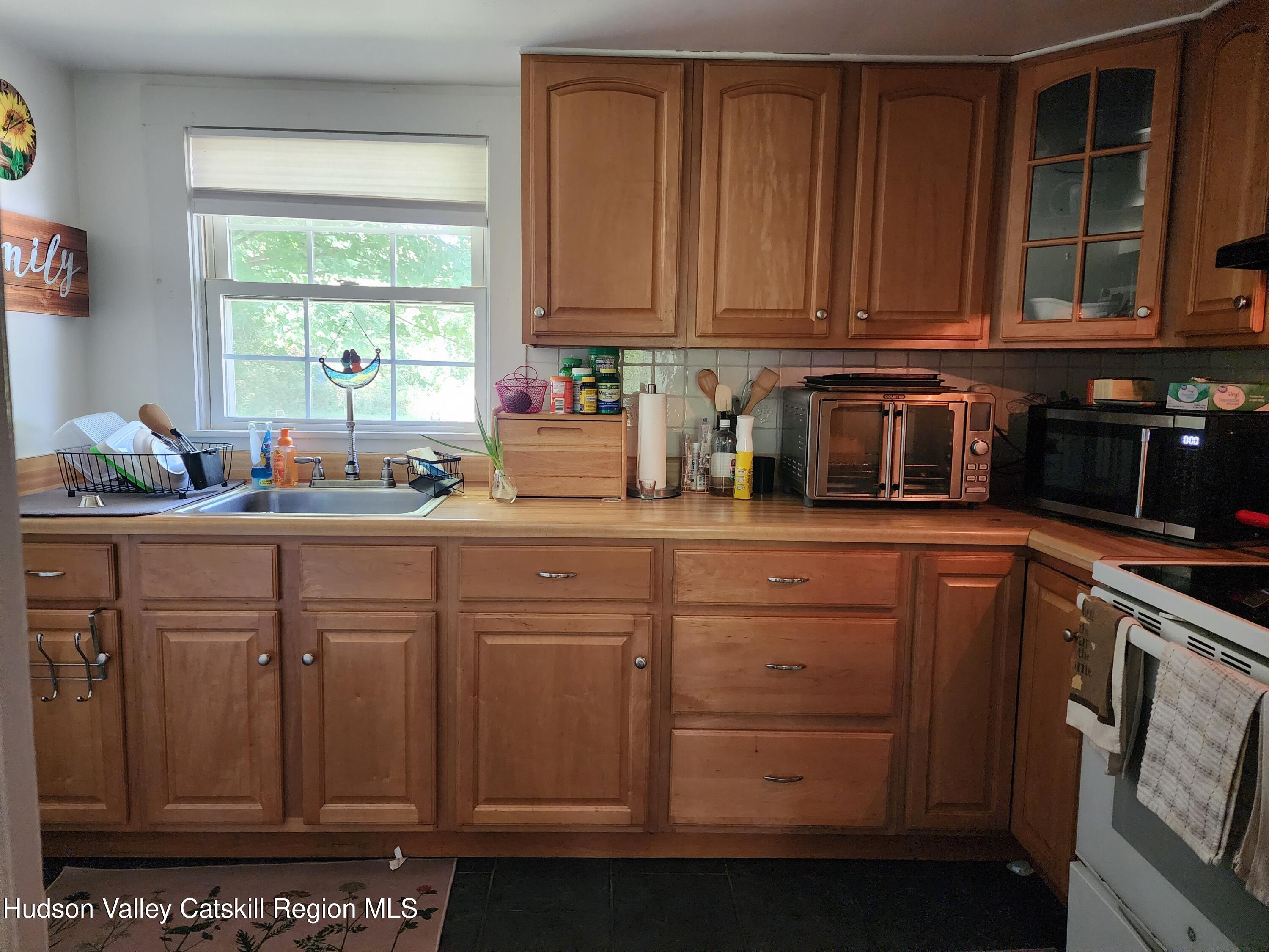 9 Hamm Road Durham, NY 12422 - Photo 19 of 21 a kitchen with sink cabinets and window