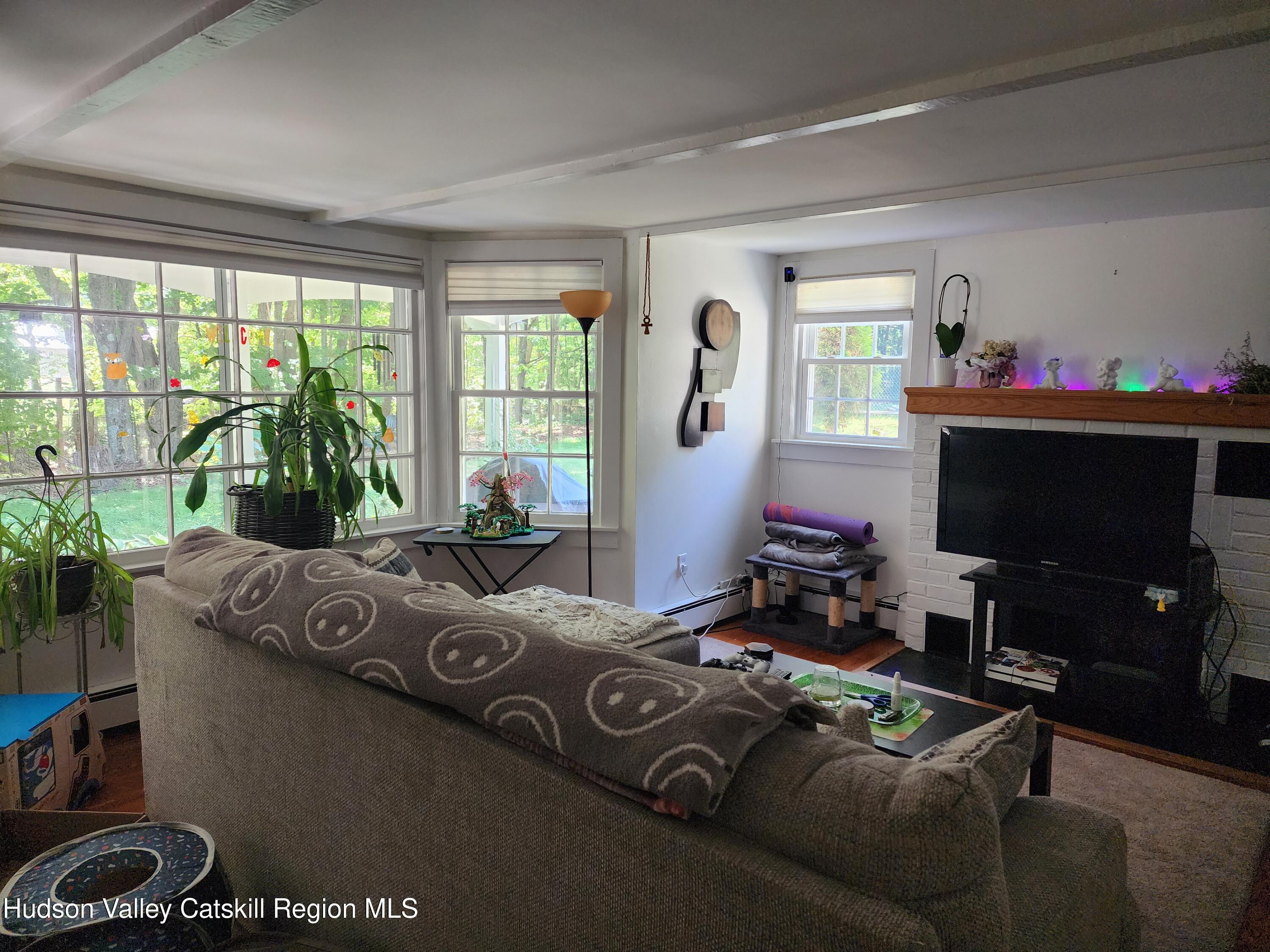 9 Hamm Road Durham, NY 12422 - Photo 21 of 21 a bedroom with furniture and a flat screen tv