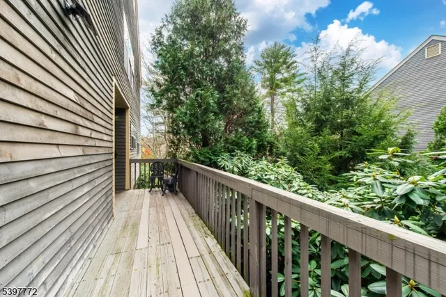 a view of balcony with wooden floor