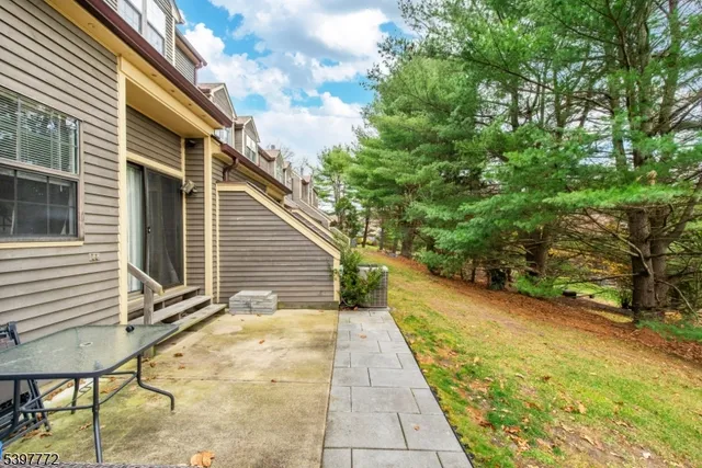 a view of a backyard with sitting area