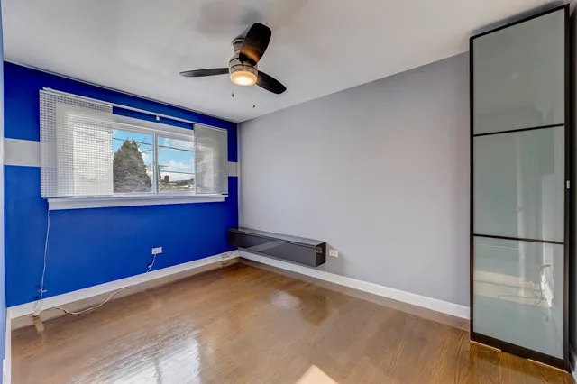 a view of empty room with a refrigerator