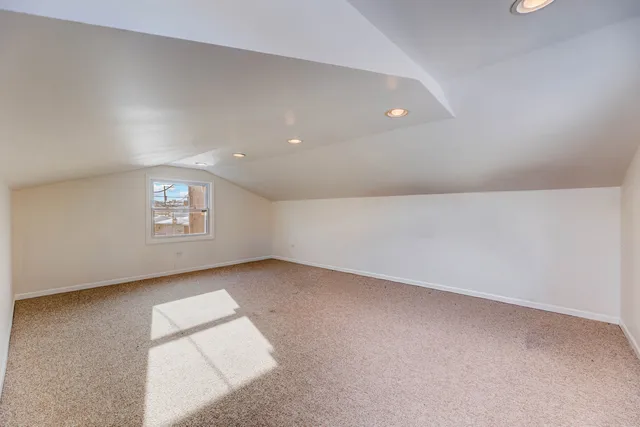 a view of an empty room and a window