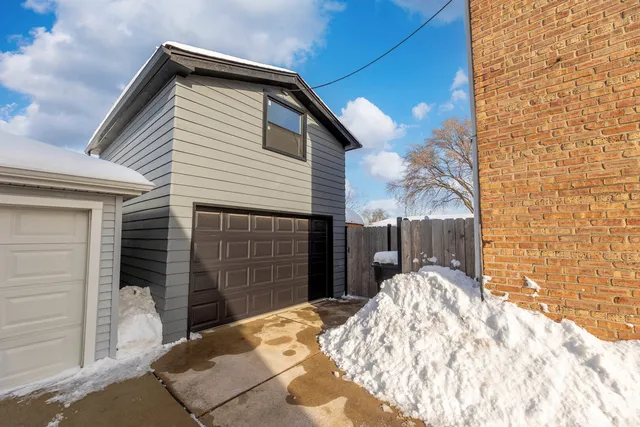 a front view of a house with a garage
