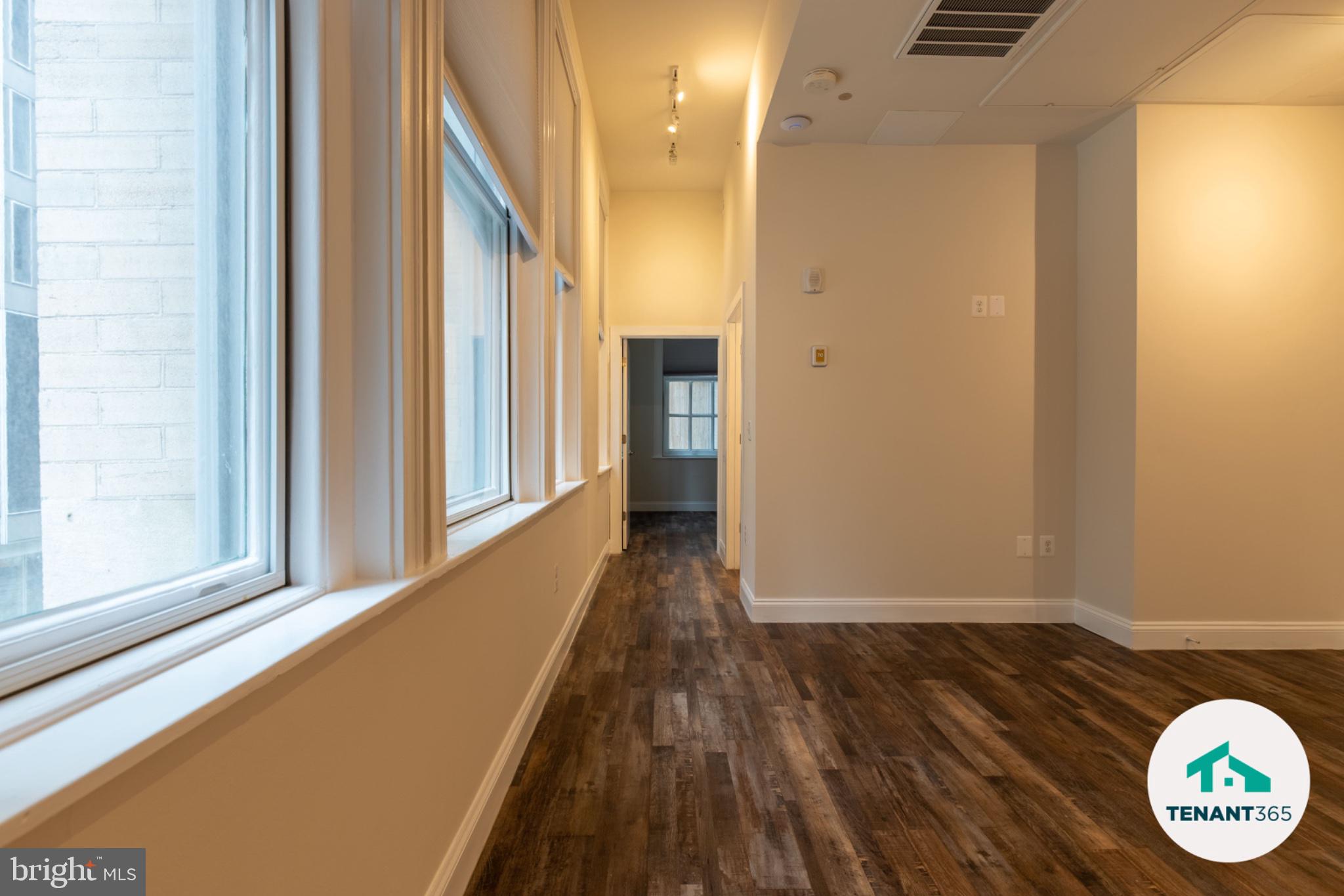 8 East Fayette Street, Unit 201 Baltimore, MD 21202 - Photo 12 of 14 Bright and inviting hallway space.