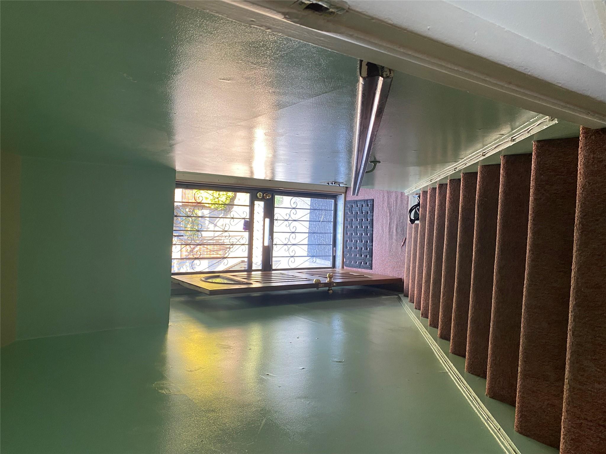 129-32 145th Street Queens, NY 11436 - Photo 13 of 15 a view of entryway and hall with wooden floor
