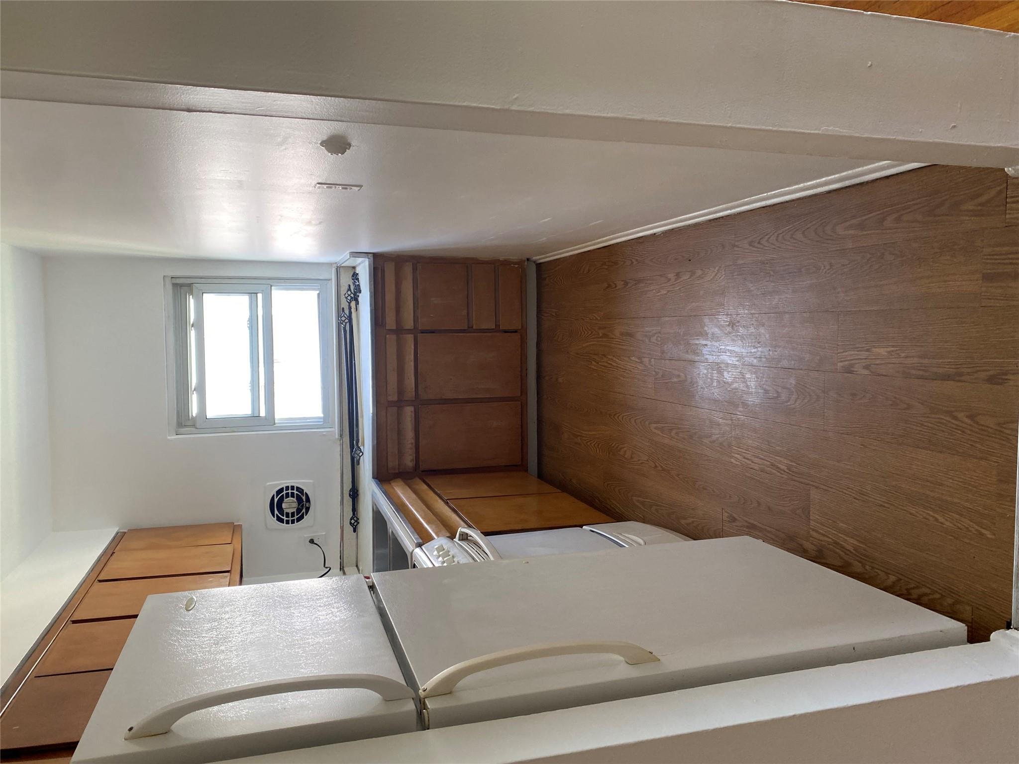 129-32 145th Street Queens, NY 11436 - Photo 4 of 15 a kitchen with stainless steel appliances a refrigerator and a sink