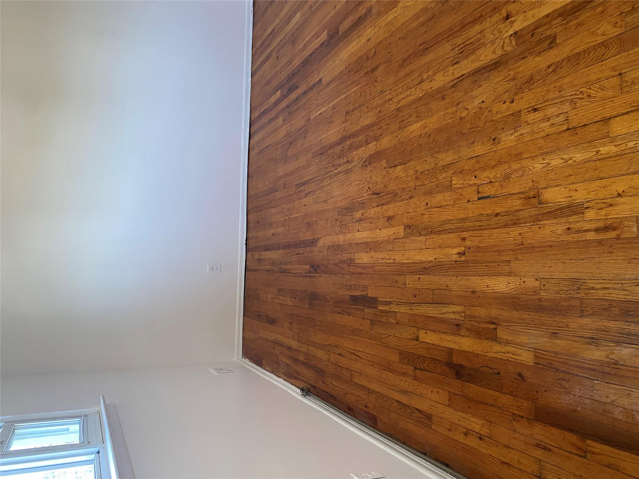 129-32 145th Street Queens, NY 11436 - Photo 7 of 15 a view of wooden floor in a room