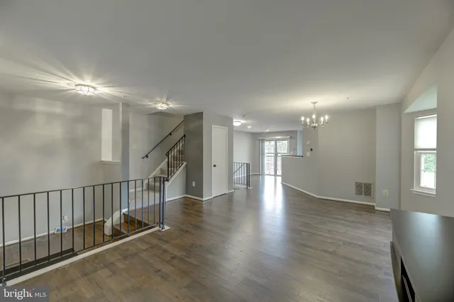 a view of an entryway with wooden floor