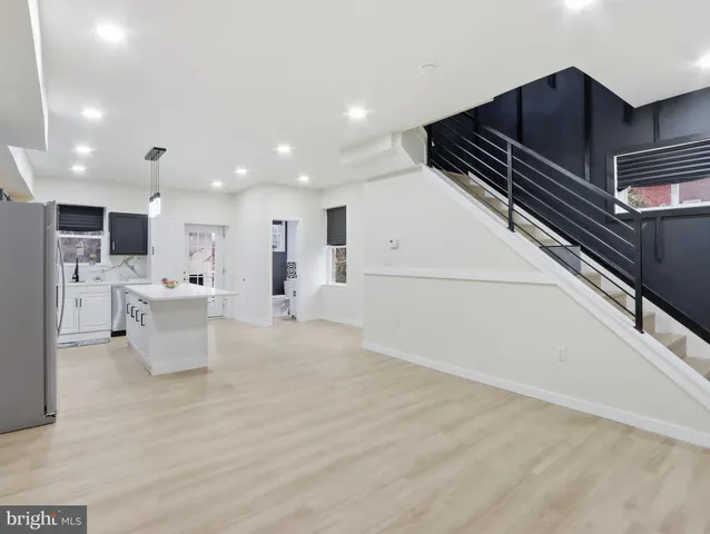 a view of kitchen with sink and microwave