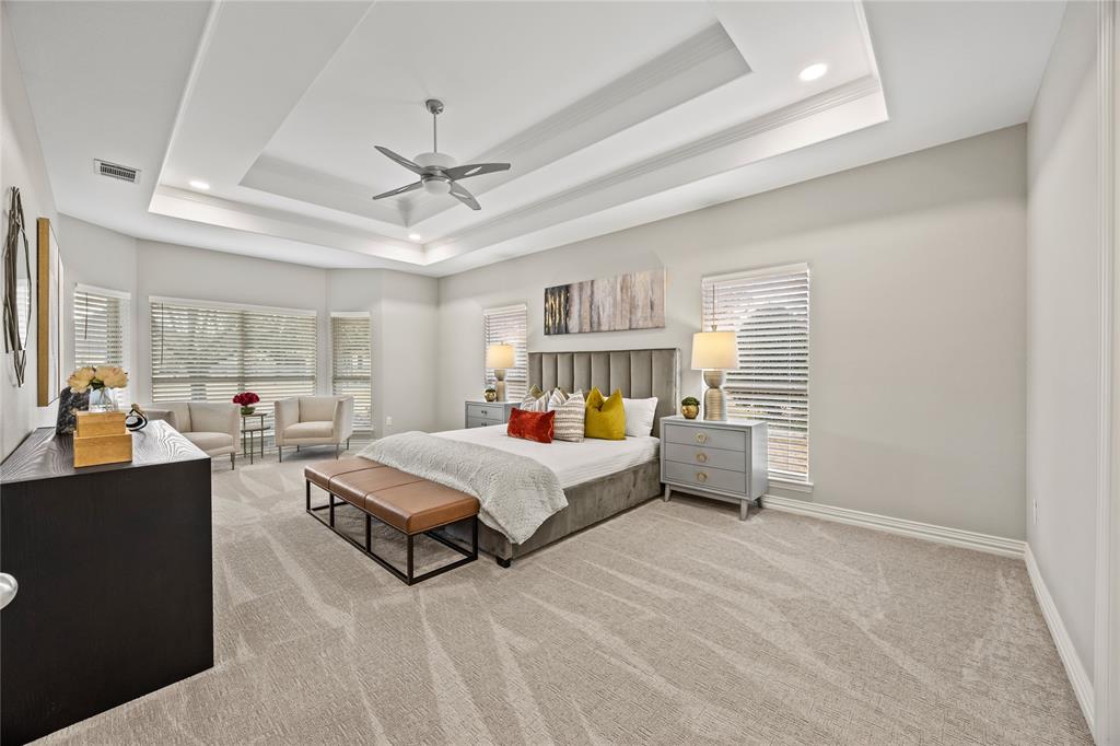 10409 Countryside Drive Denton, TX 76207 - Photo 22 of 38 Bedroom featuring light carpet, a ceiling fan, recessed lighting, and a raised ceiling