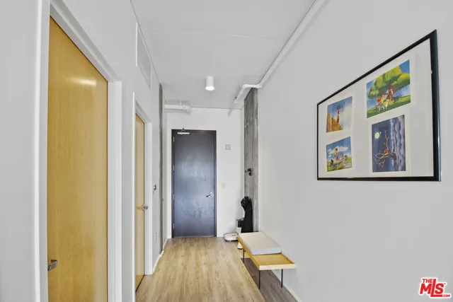 a view of living room with furniture and a floor to ceiling window