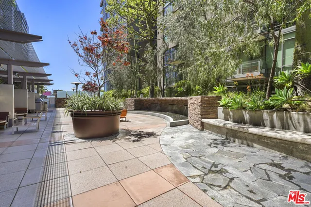a outdoor space with patio furniture and potted plants