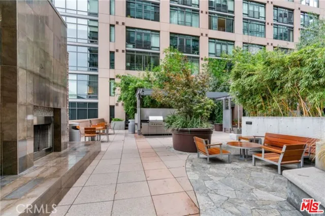 a living room with furniture and large windows