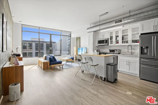 a room with furniture pool table and flat screen tv