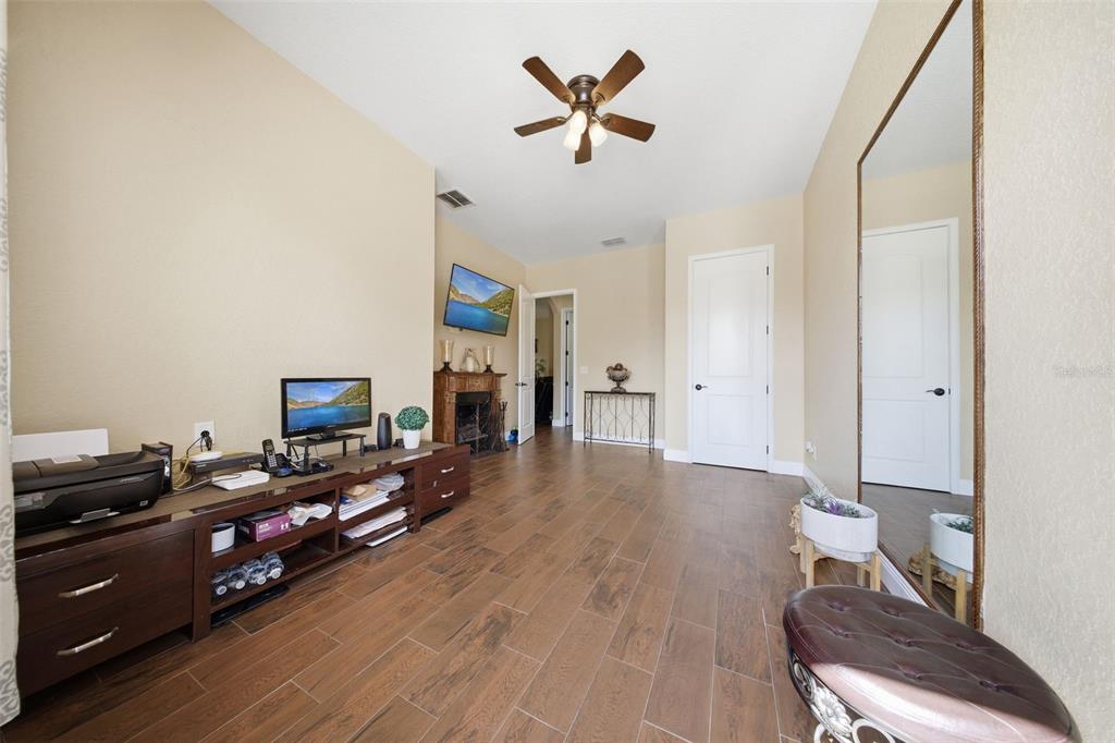 13429 Montevista Road Clermont, FL 34711 - Photo 41 of 89 a living room with furniture and a flat screen tv