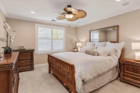 a bedroom with a bed and cabinets