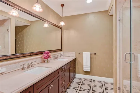 a spacious bathroom with a tub shower and sink
