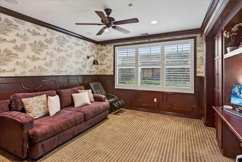 a bathroom with a sink vanity mirror and toilet