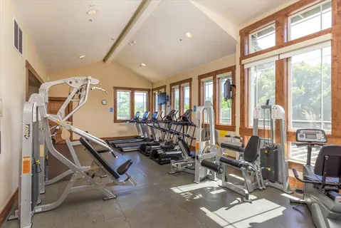 a view of parking garage with cars parked